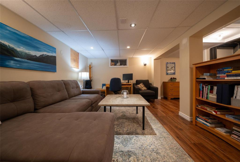 Laminate floors, pot lights & drop ceiling.