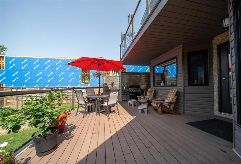 Composite wood deck with covered BBQ nook.