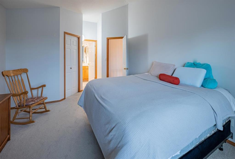 PRIMARY BEDROOM WITH VAULTED CEILINGS