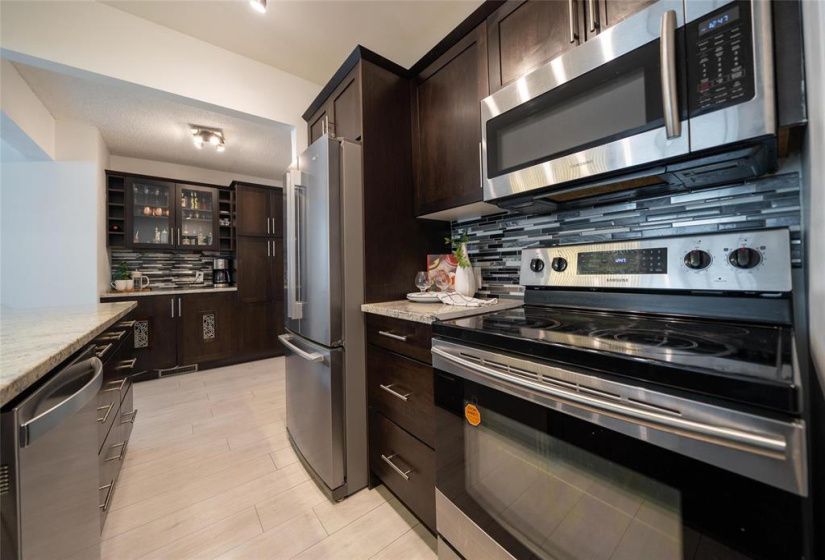 Stainless steel appliances and granite counters.