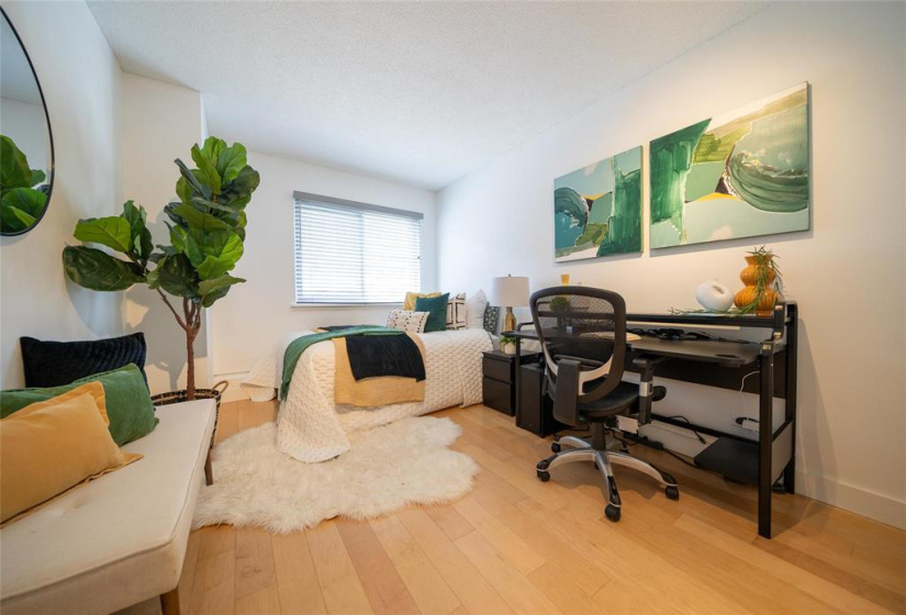 Bedroom 2 with engineered hardwood floors.