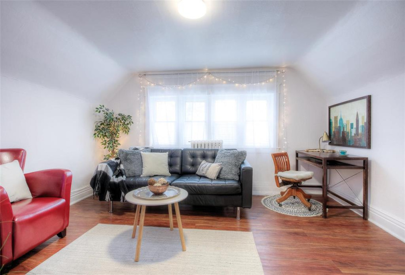 Top floor primary bedroom, staged as livingroom