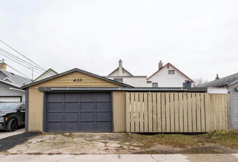 Garage and rolling fence for carport