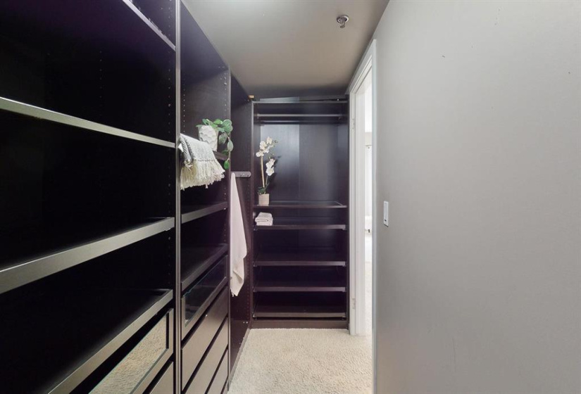 CUSTOM BUILT WALK IN CLOSET WITH PLENTY OF ROOM FOR STORAGE FOR ALL OF YOUR CLOTHING AND ACCESSORIES!