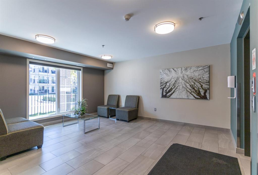 Lobby Area, one of two nice sharp looking front entrance lobby areas!