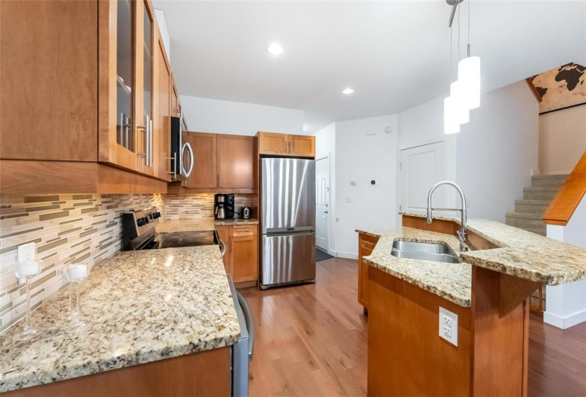 Kitchen with maple cabinets, granite counters, stainless steel appliances