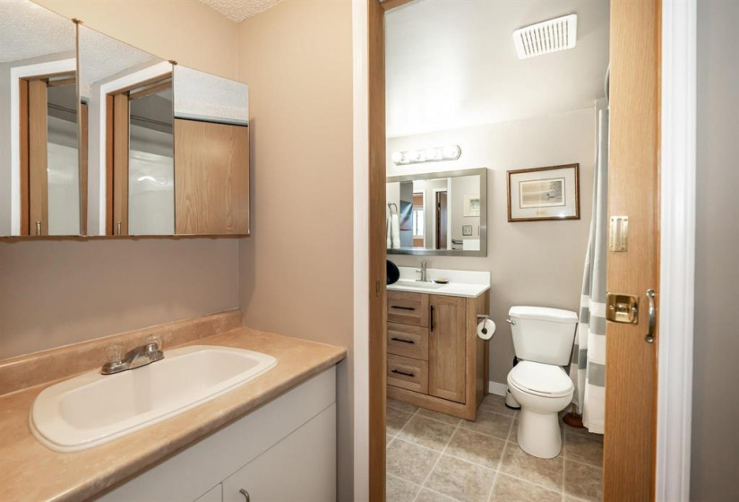 Bonus sink in pass-through from primary bedroom to main bath