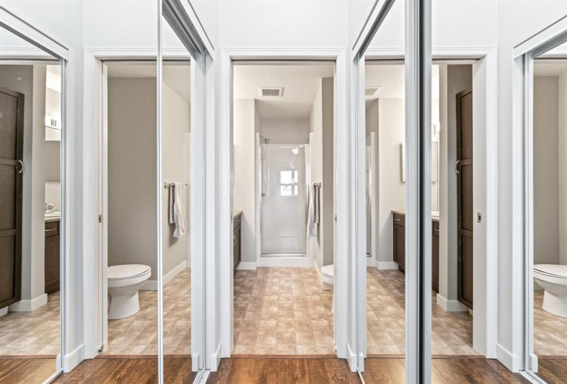 His & her closets in the primary bedroom